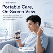 Man using Sofbunny A07 visual ear care kit with portable on-screen viewing at home